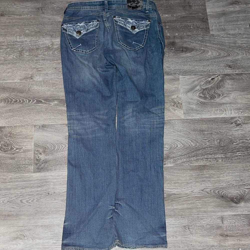 Apple Bottoms blue bootcut jeans with distressed details